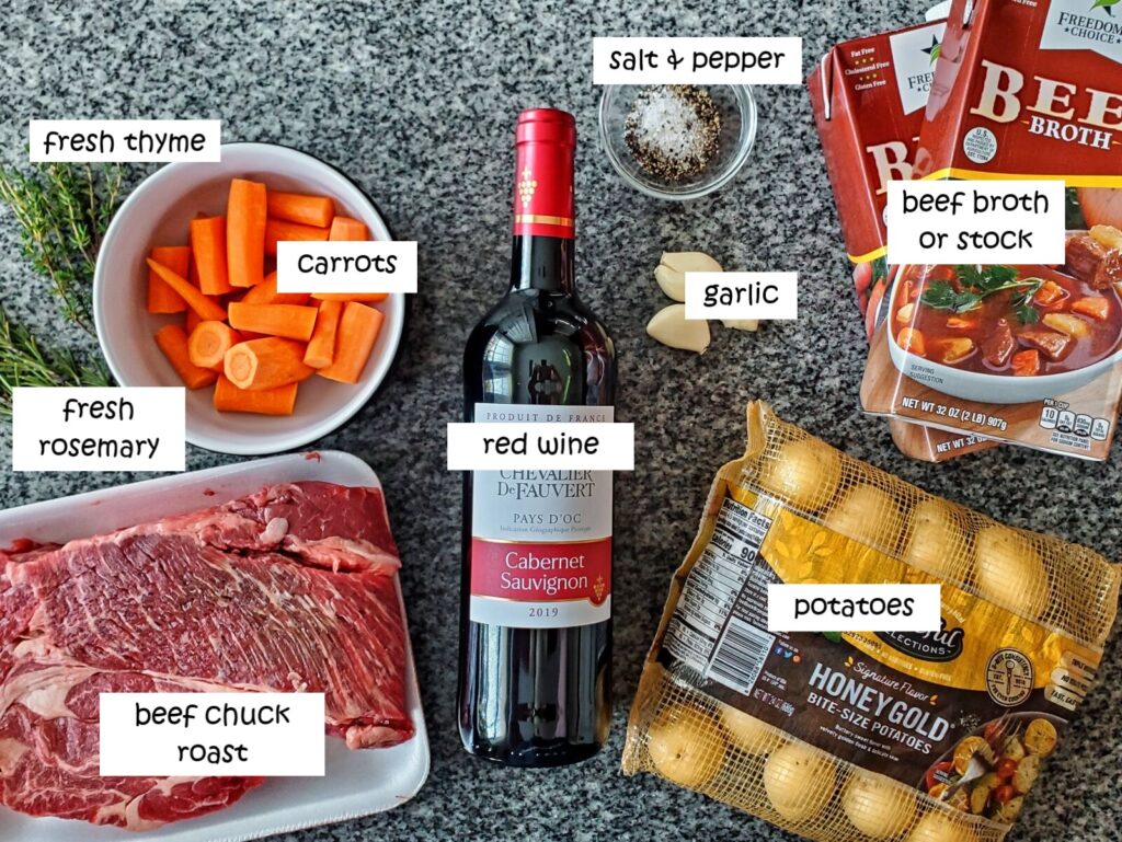 ingredients needed for pot roast labeled and measured on granite countertop.