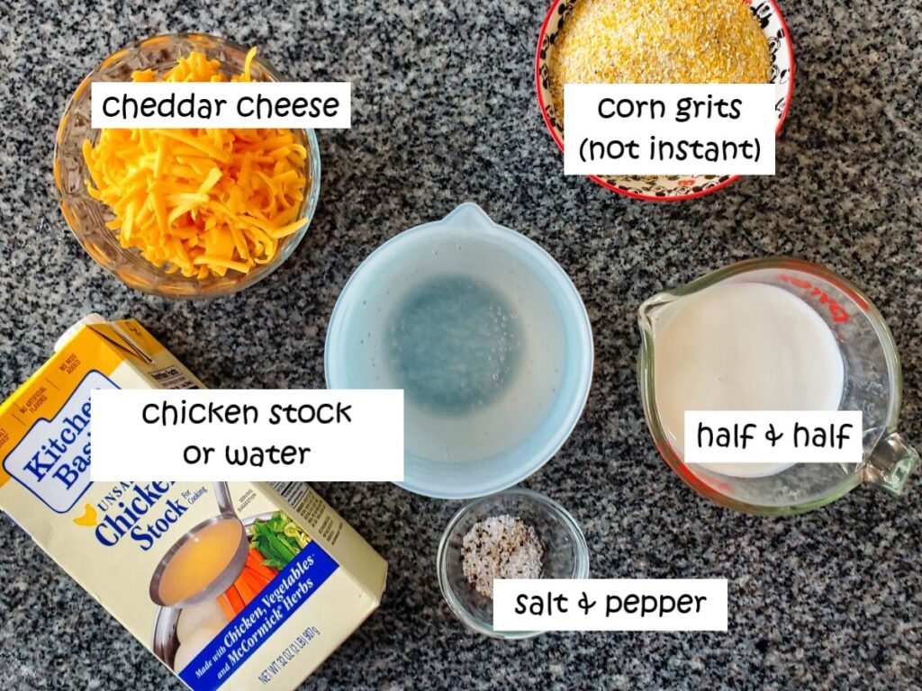 ingredients needed for cheese grits measured out and labeled on granite countertop.