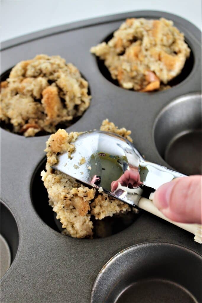 scooping stuffing into muffin pan