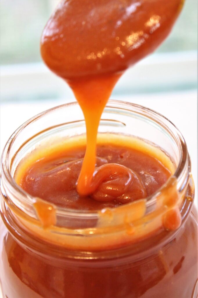 dee's bbq sauce dripping from spoon