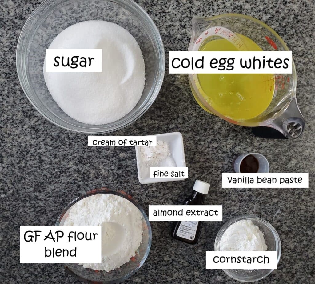 ingredients for angel food cake measured and labeled on countertop.
