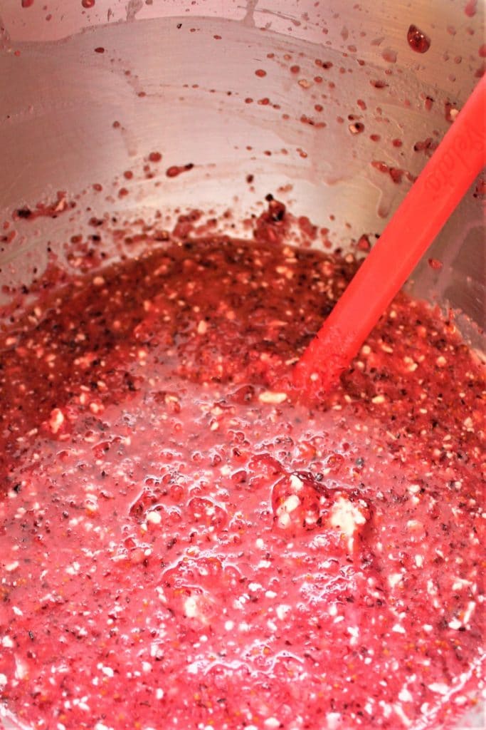 curdled looking cranberry curd in mixing bowl