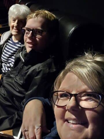 me, mom, and Brandon at the movies