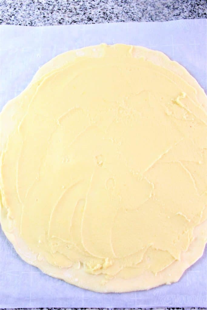 dough round spread with almond cream