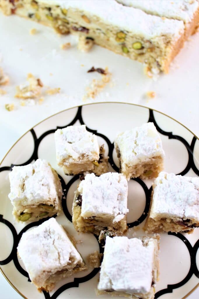 stollen bars cut into squares and placed on white and black plate