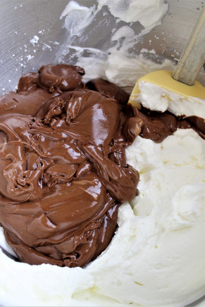 adding lightened chocolate into whipped cream