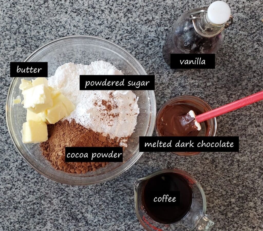 ingredients separated in bowls for chocolate fudge frosting.