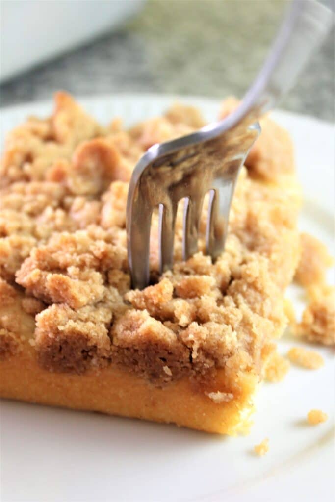 gluten free crumb cake piece with a fork in it