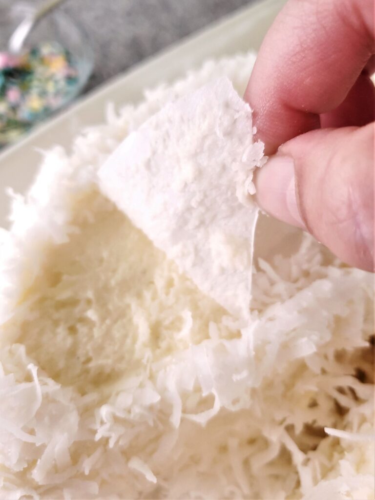 removing parchment from bunny ears on cake