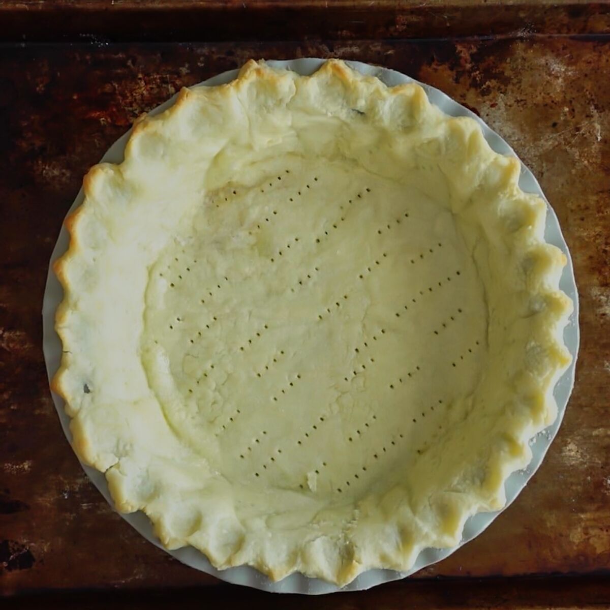 Pie crust on old baking sheet.