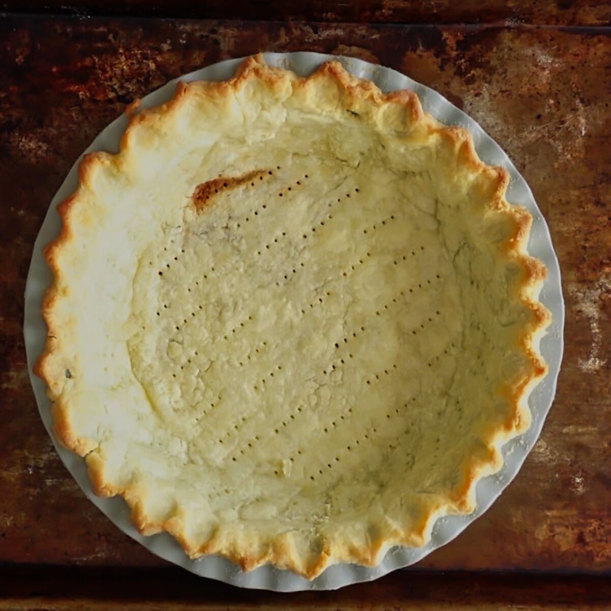 fully par baked pie crust on old baking sheet.