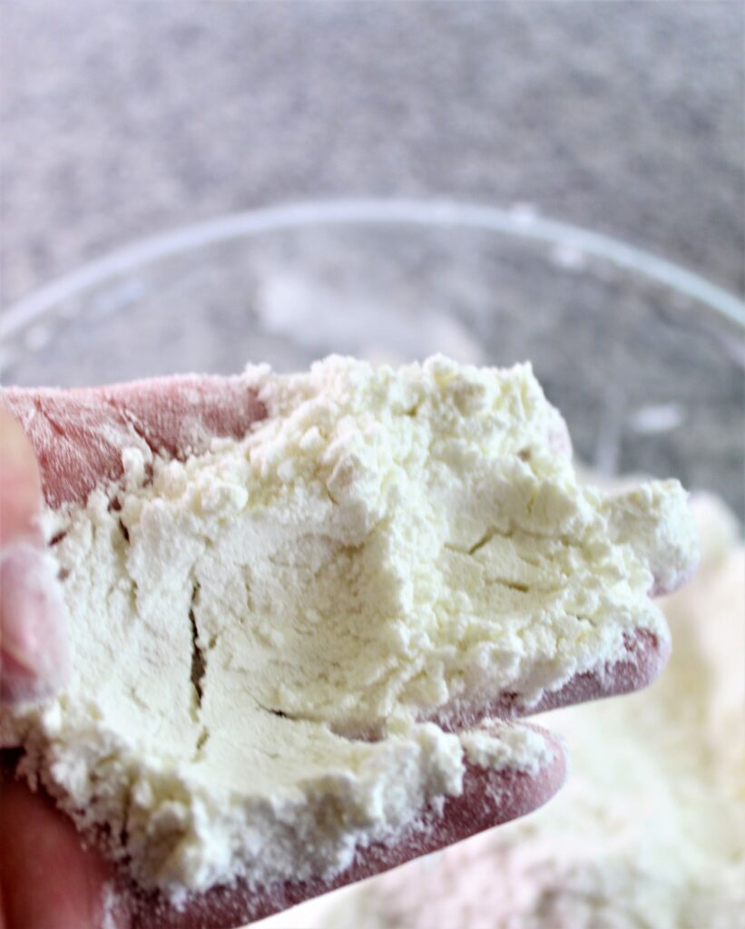 mixing butter into dry ingredients until like breadcrumbs