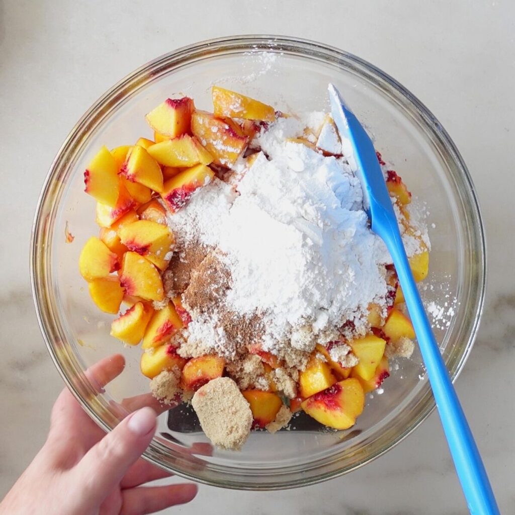 peach filling ingredients in large glass bowl.