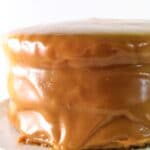 gluten free caramel cake on white cake stand