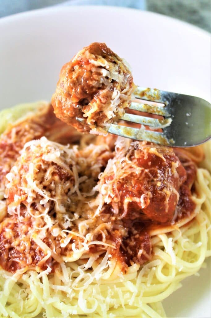 gluten free spaghetti and meatballs with meatball on fork