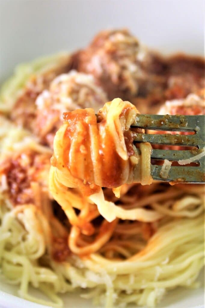 gluten free spaghetti and meatballs twirled on fork