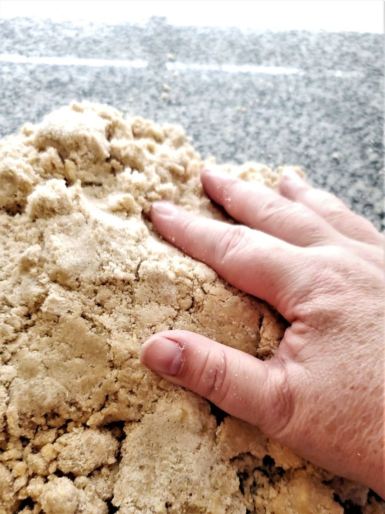 packing dough into a cohesive mass