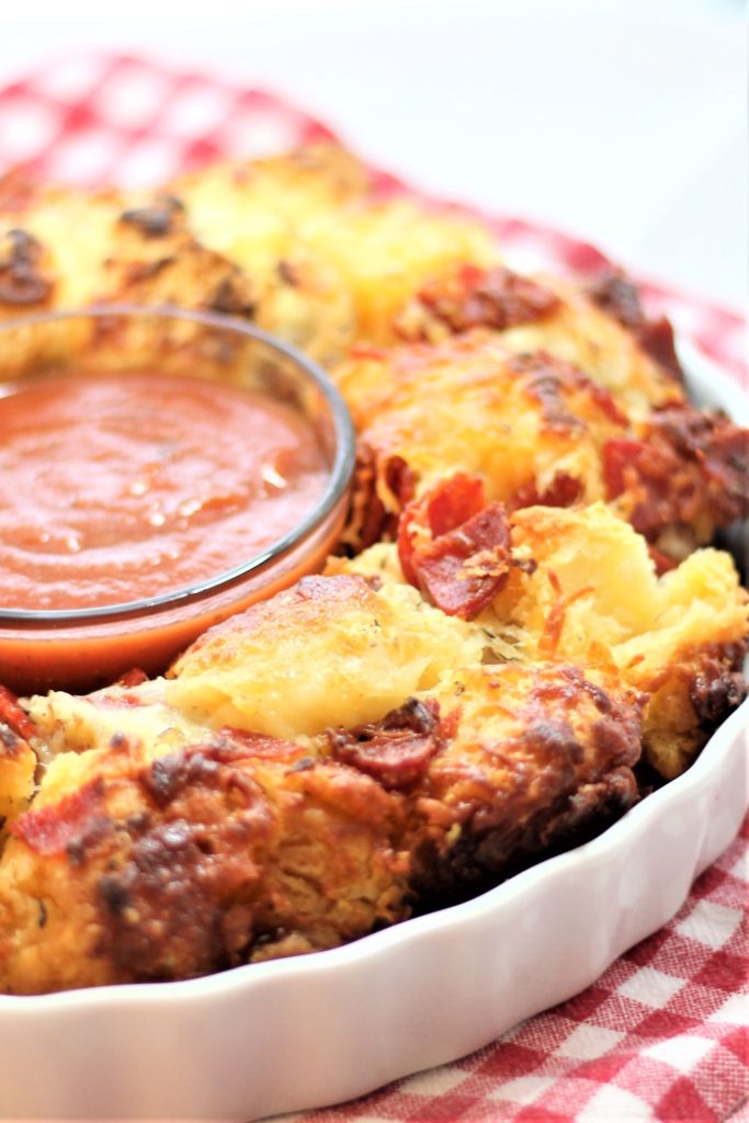 monkey bread with pizza sauce on red checked towel