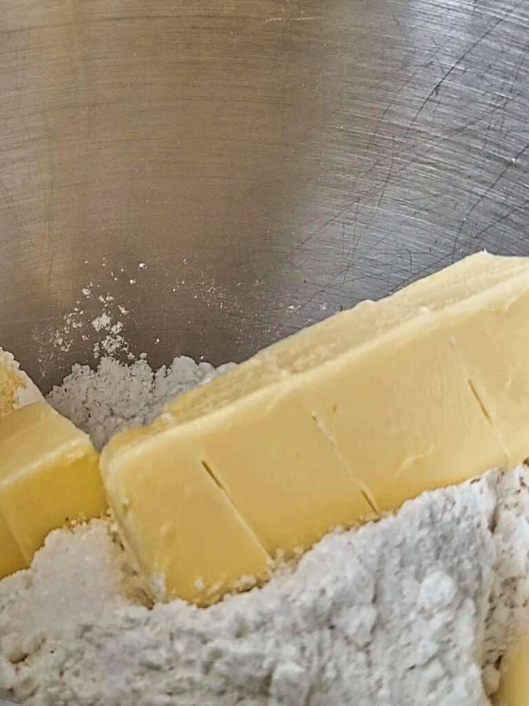 butter and dry ingredients in mixing bowl.