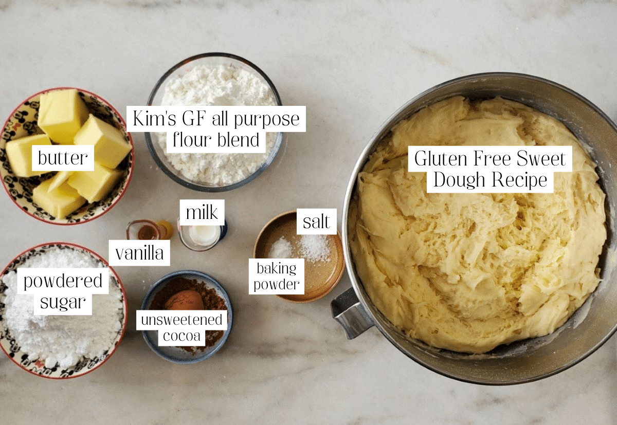 ingredients for conchas measured out and labeled on marble countertop.