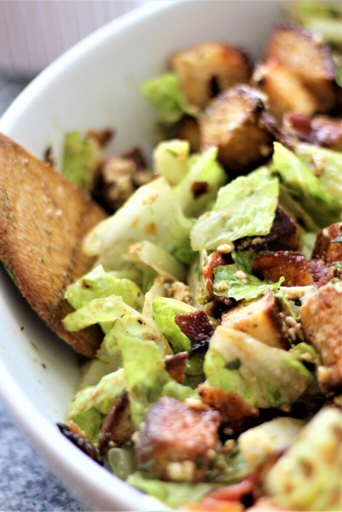 gluten free luxembourg salad in white bowl.