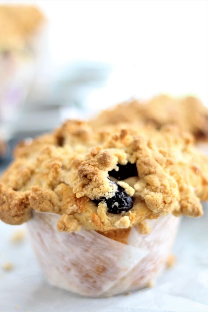 jumbo gluten free blueberry muffin on parchment paper