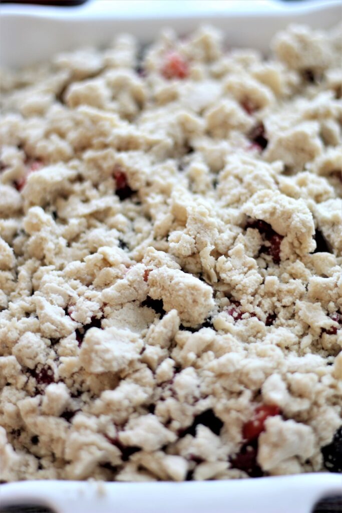 fruit topped with crumble and ready to bake