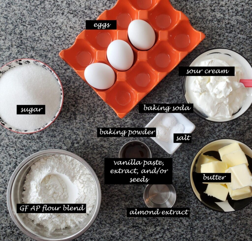 ingredients for cakes measured out individually on granite countertop.