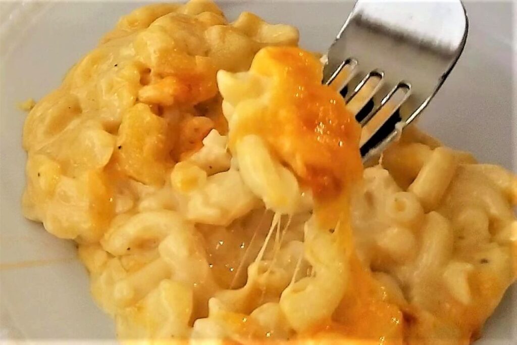 serving of baked gluten free mac and cheese on white plate