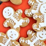 gf gingerbread skeleton cookies on orange cloth napkin