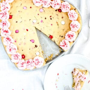 brown butter heart shaped cookie cake with slice on the side