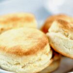 cream biscuits in a white bowl
