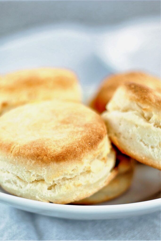 cream biscuits in a white bowl