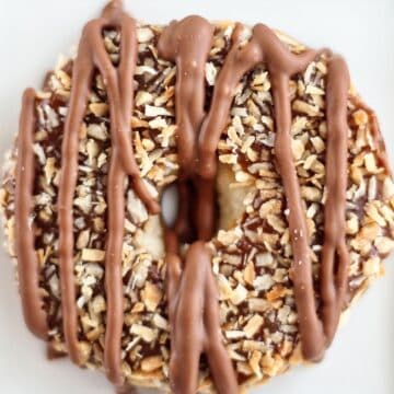 one gluten free samoa cookie on a white background