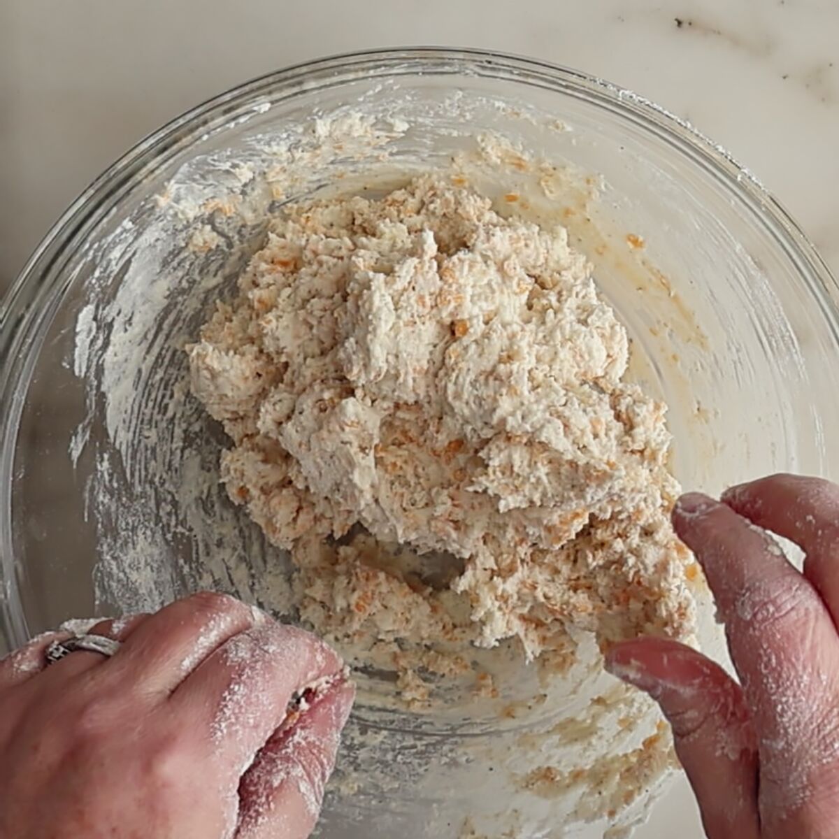 wet scone dough in large glass bowl.