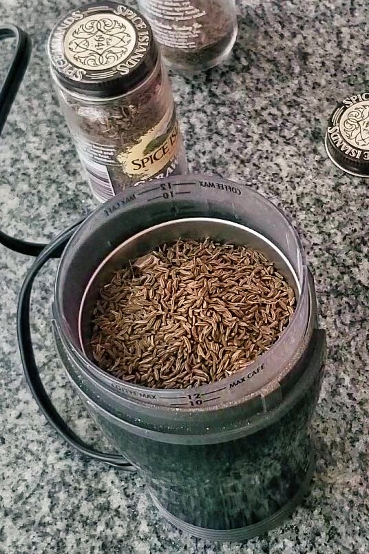 whole caraway seeds in spice grinder