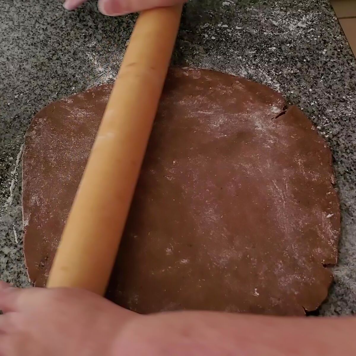 rolling out chocolate dough.