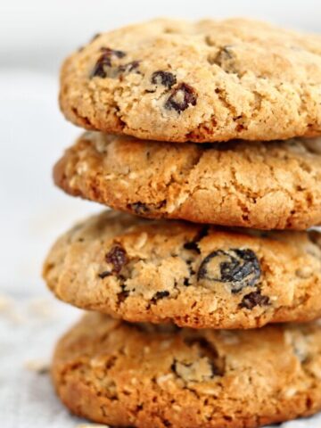 landscape view of a stack of four oatmeal raisin cookies