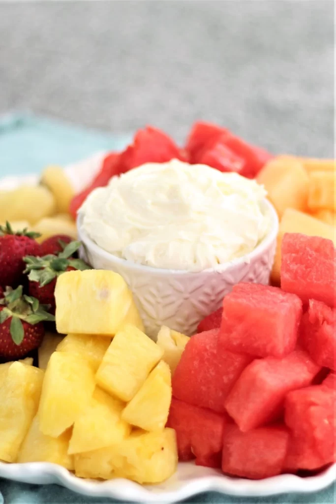 fluffy marshmallow fruit dip surrounded by fruit