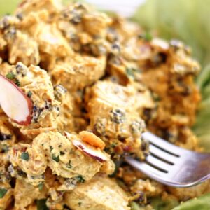 curry chicken salad on a bed of butter lettuce