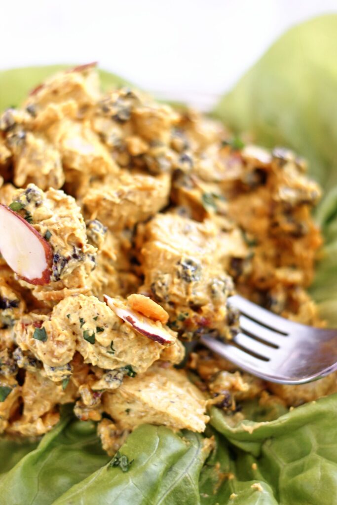 curry chicken salad on a bed of butter lettuce