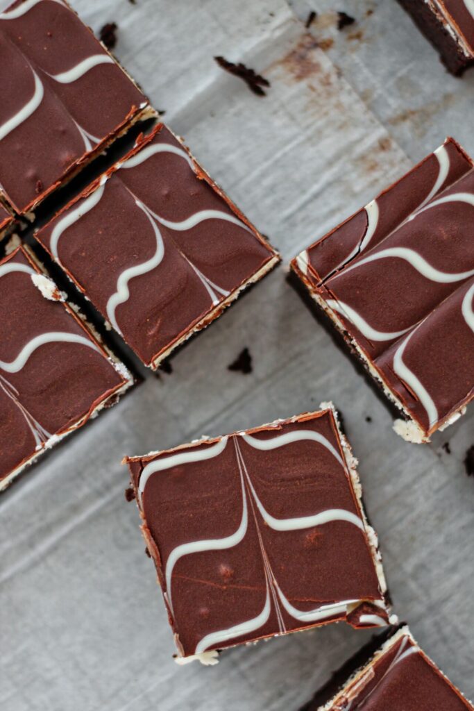 overhead shot of brownies on white parchment