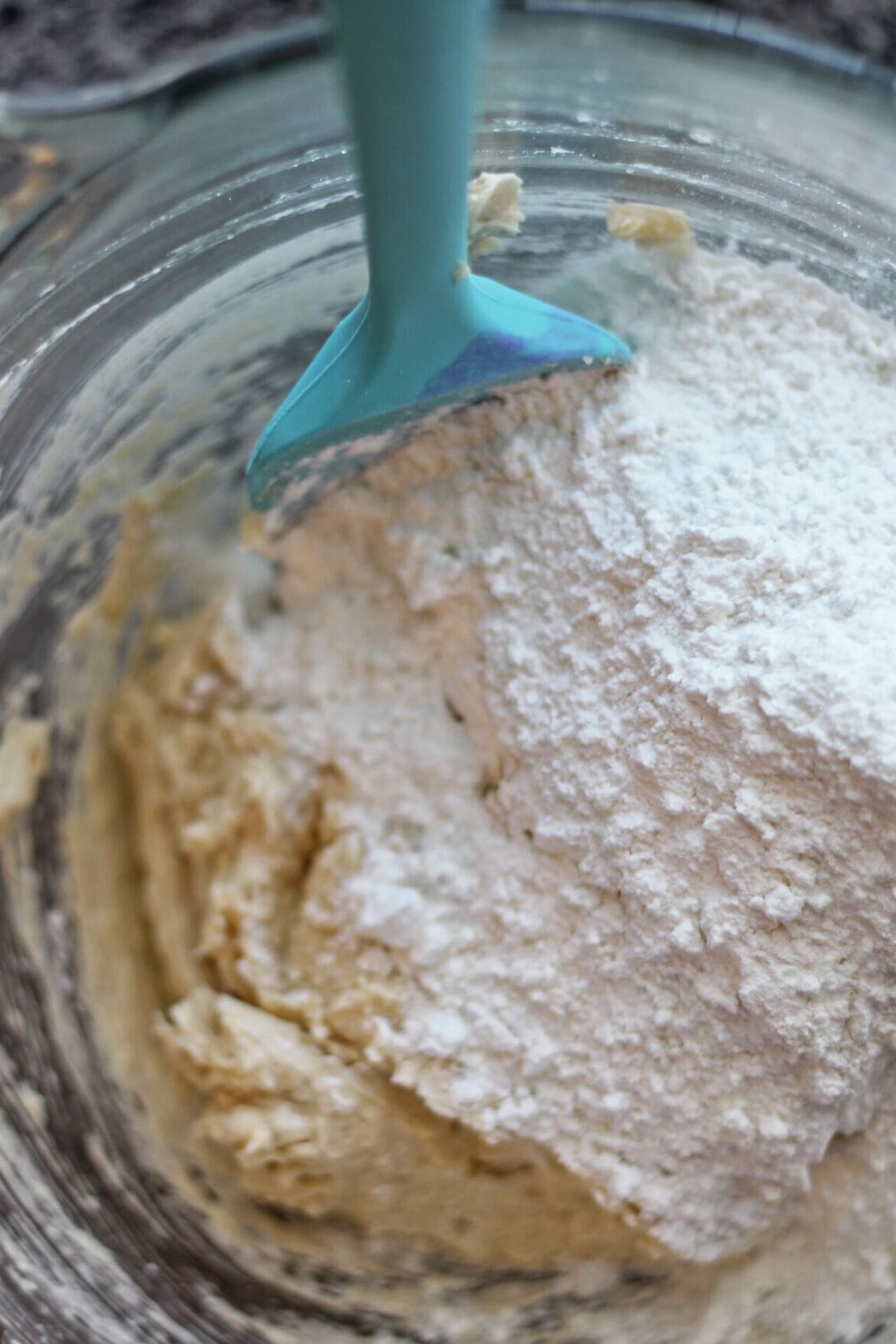adding dry ingredients to butter mixture