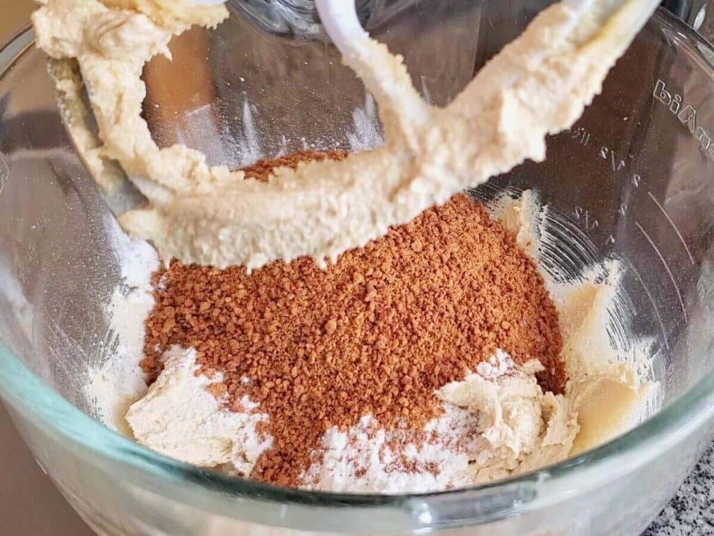 adding graham cracker crumbs on top of flour mixture.