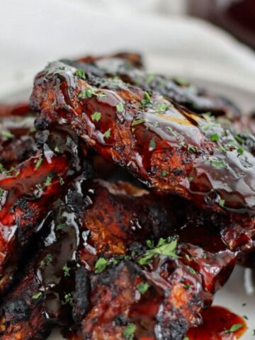 ohana honey coriander wings on white plate over white towel