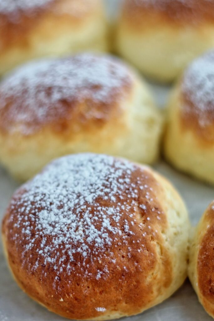 potato brioche buns dusted with potato starch on parchment