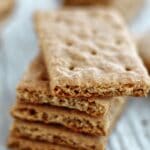 stack of gluten free graham crackers on parchment