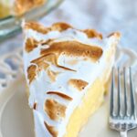 slice of gf lemon meringue pie on white plate