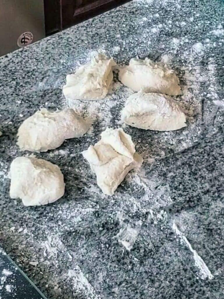 rolls divided into 2 ounce pieces on floured surface.