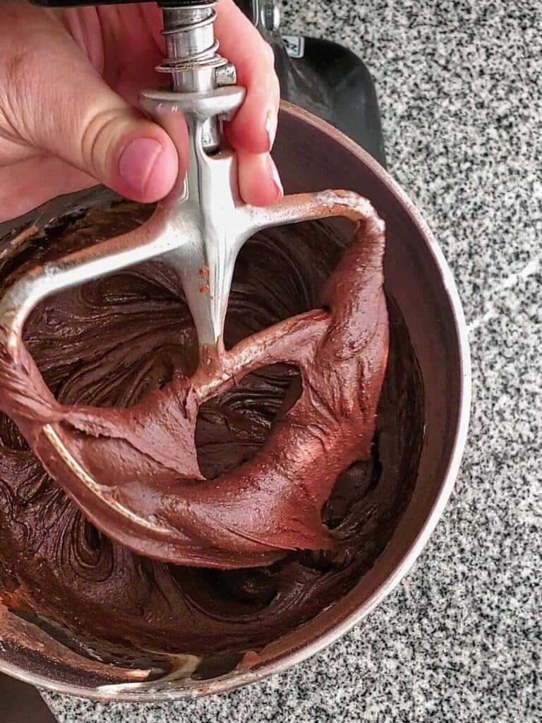 brownie batter on beater blade of kitchenaid stand mixer.